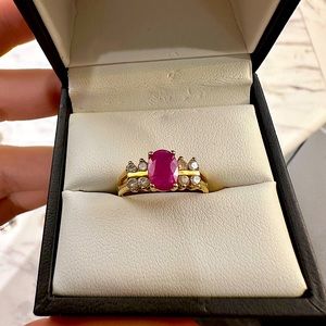 Absolutely stunning ring. Ruby with 8 diamond in 10K yellow gold. Size 5.0